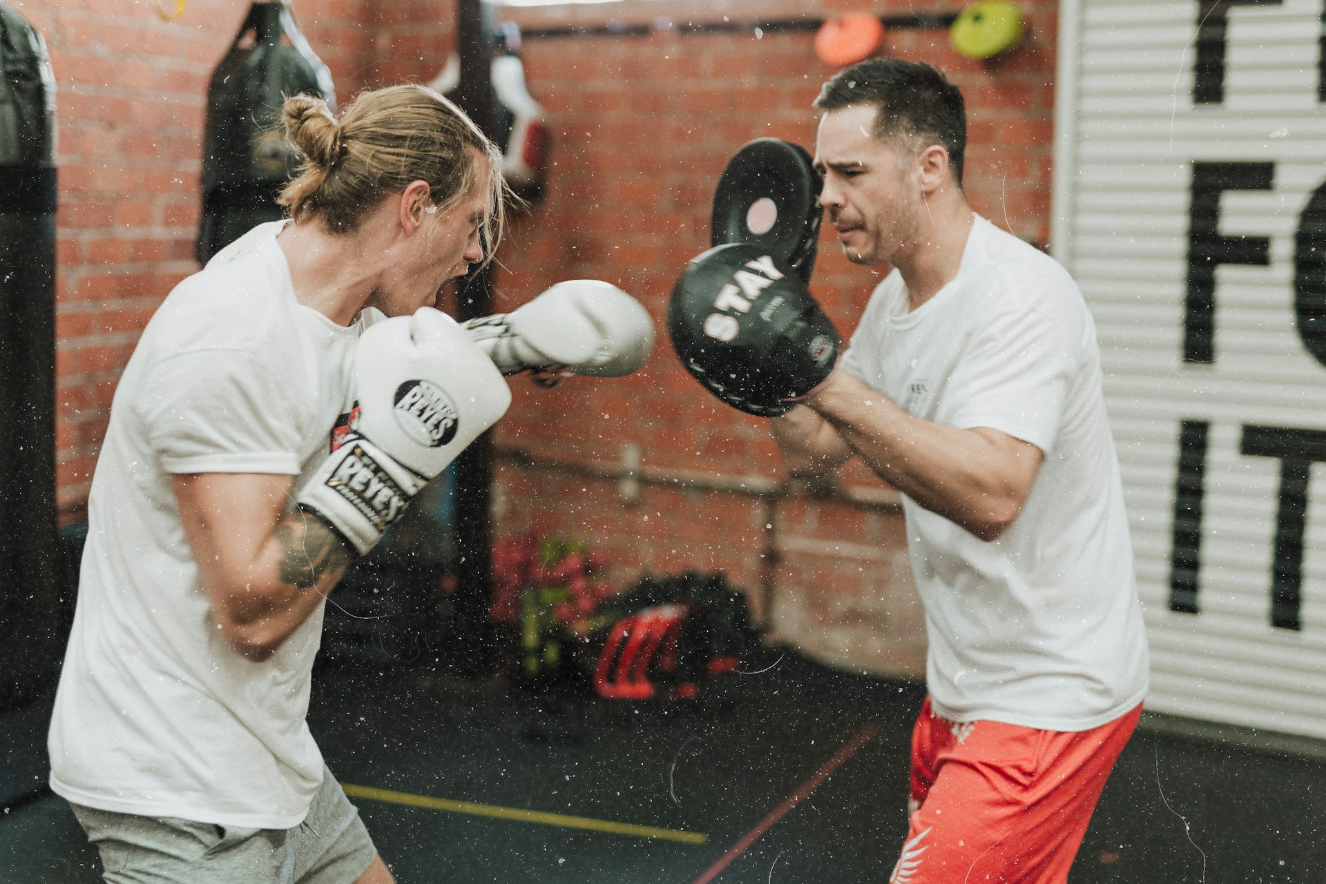Boxer in the ring mid-punch
