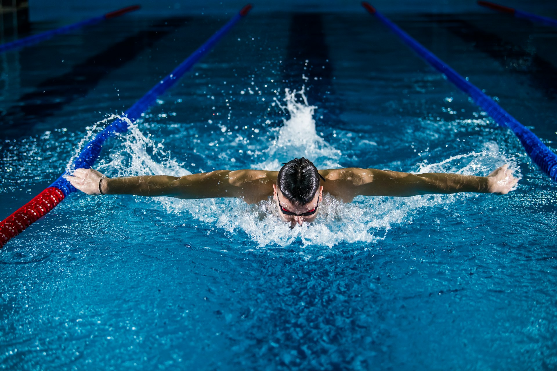 Swimmer mid-stroke in competition